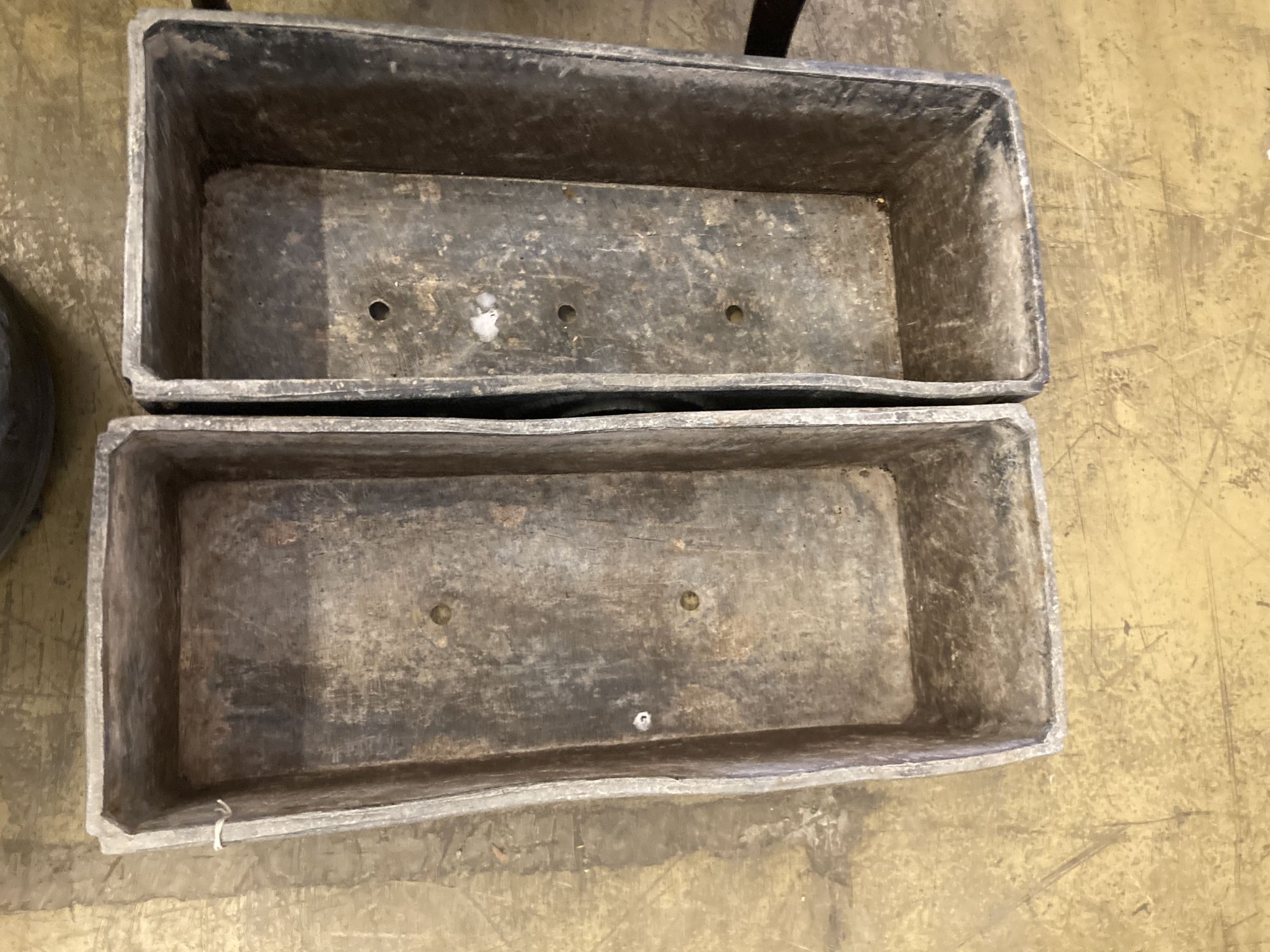 A pair of rectangular lead garden planters, width 60cm, depth 24cm, height 23cm